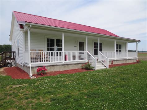 red and white metal house|houses with white metal roofs.